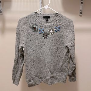 Chic lambswool crewneck sweater with jewel embellishment